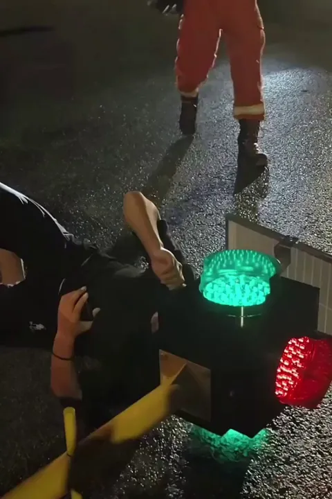 A Chinese man got his head stuck in a temporary traffic light after crashing his electric scooter. It took 40 minutes for the emergency services to free him.
