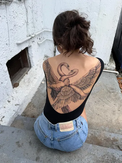 Entangled swans back piece by @chriscalibur_ at Ocho Placas in Miami