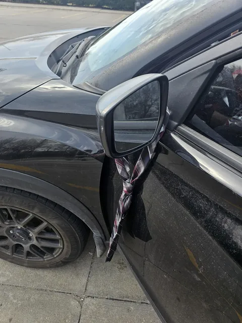 Someone put a tie on my car while I was in the strore.