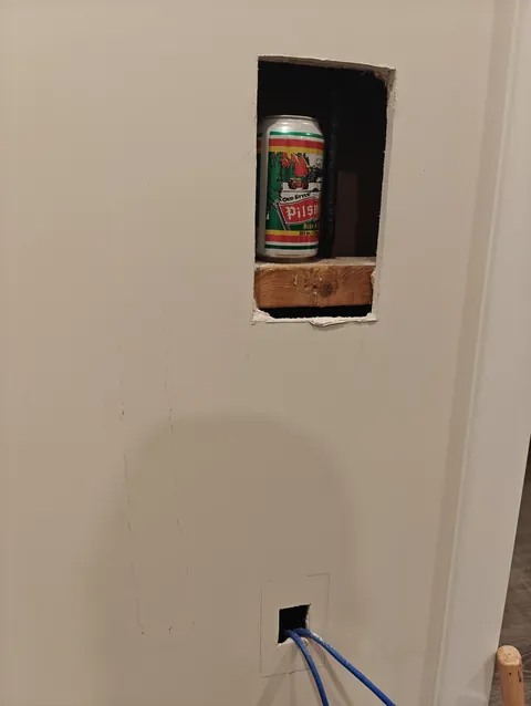 Found very old beer can while running Ethernet cable through a wall