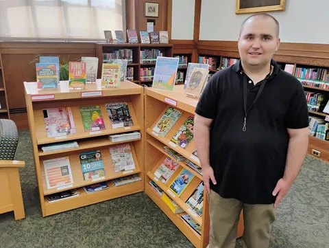 I made a book display about summer camp at my job at my local library part 6