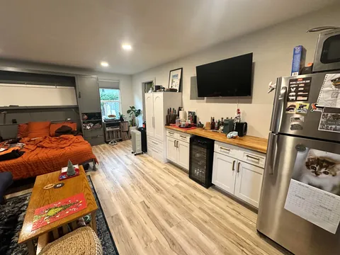 Turned my 1903 three car garage into 1/2 garage and 1/2 bedroom and bathroom my