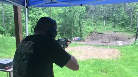 AK-47 muzzle blast deflecting rain