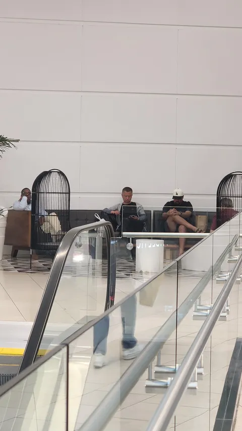 I present: Bored men waiting for their wives.