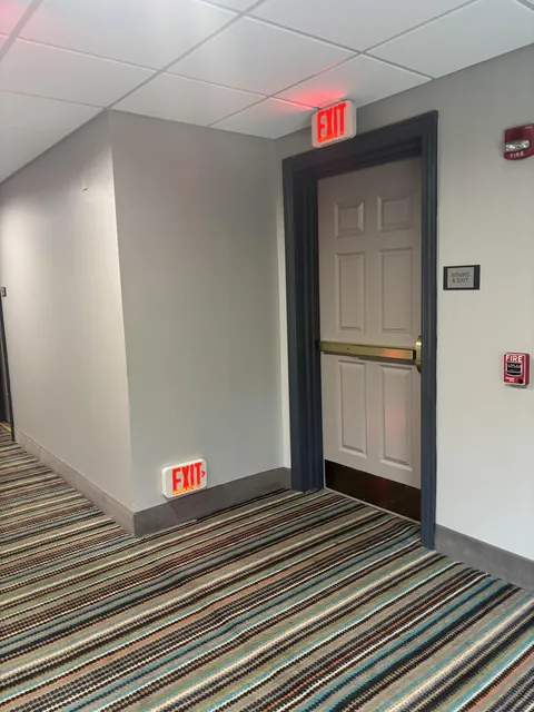The emergency exit at this hotel has floor signs