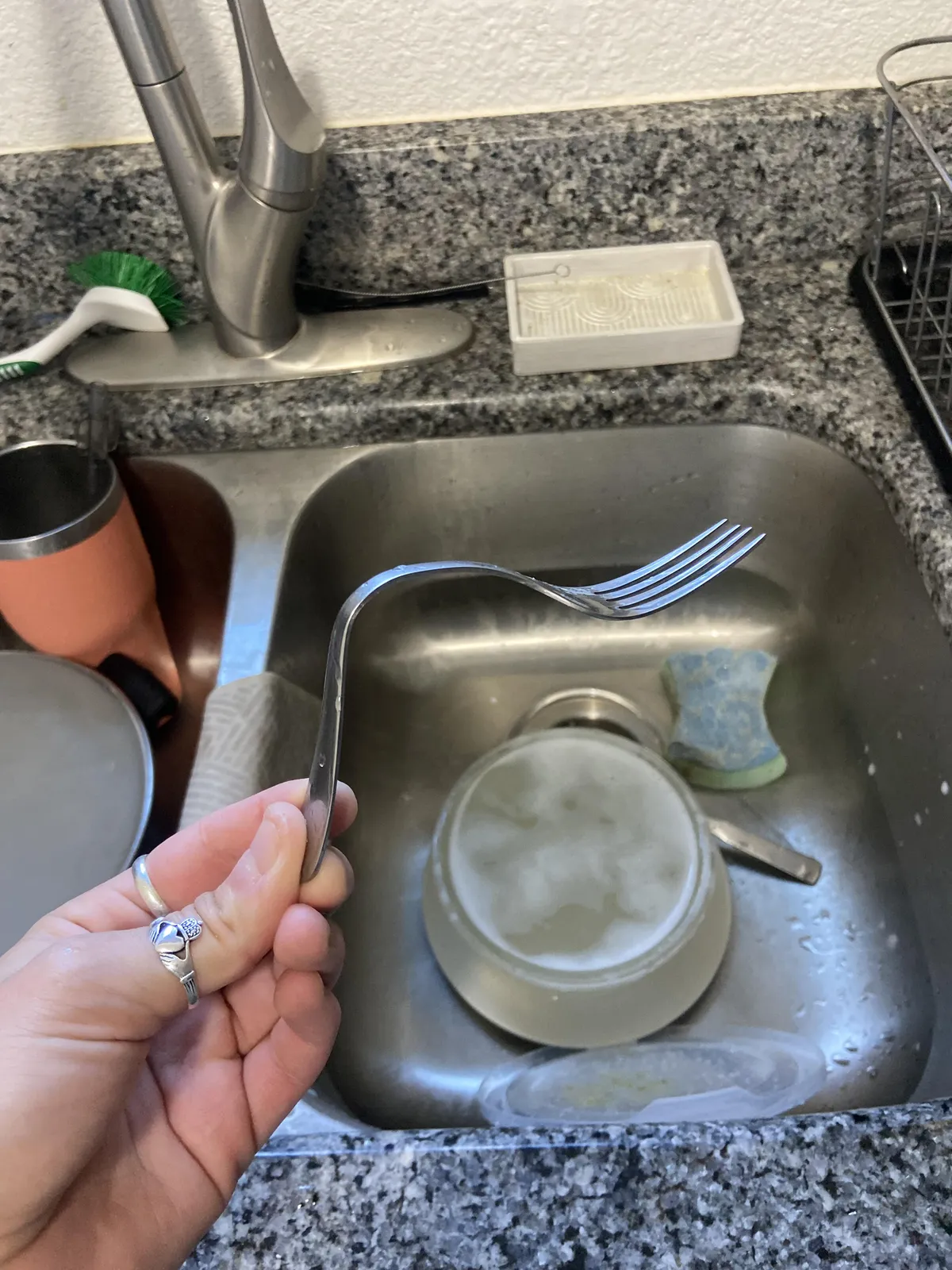 Instead of wrapping the fork in a napkin and putting it in his backpack, by boyfriend bends it so that it fits into the Tupperware his lunch was in. I was speechless upon discovery. 