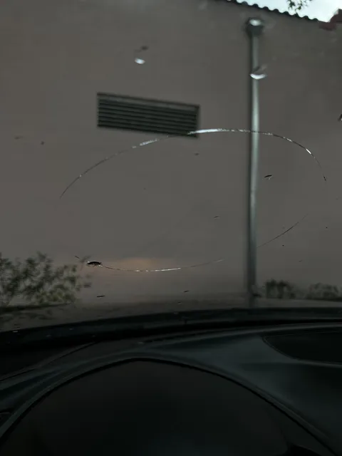Windshield cracked as a perfect circle