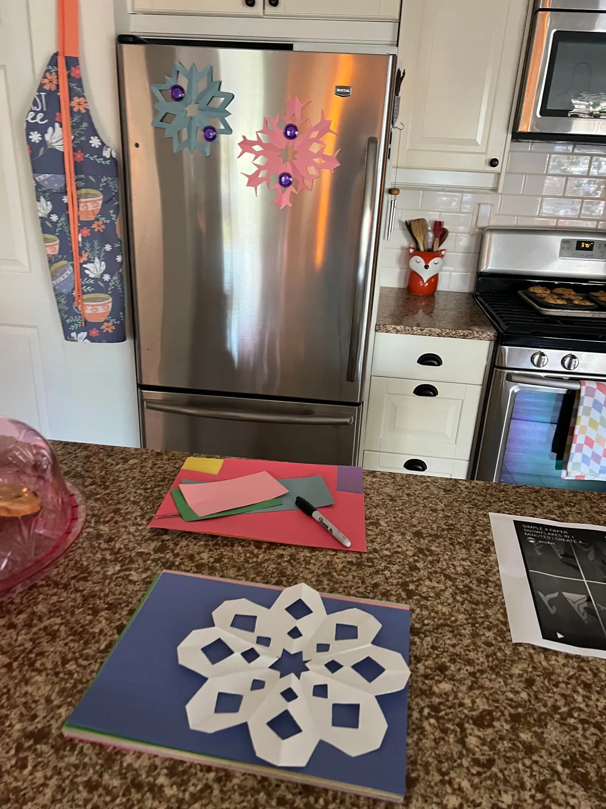 Baking and making snowflakes while my girl lounges in the window 🐈‍⬛💛