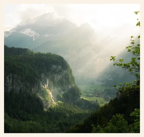 Beam of light hitting Switzerland valley.
