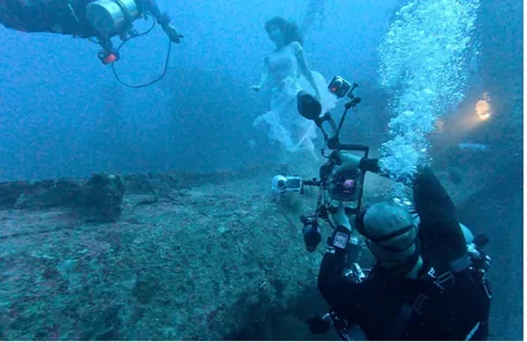 Canadian photographer Steven Haining breaks world record for deepest underwater photoshoot at 163ft - model poses on shipwreck WITHOUT diving gear