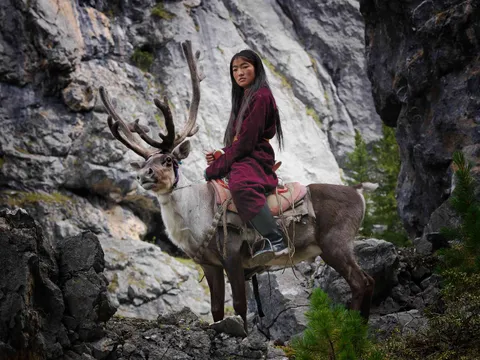 A member of the Tsaatan Tribe in northern Mongolia, one of the few remaining groups of nomadic reindeer herders in the world