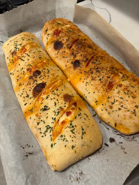 [homemade] Stromboli! Thin layer of marinara, Genoa salami, pepperoni and ham with provolone cheese.