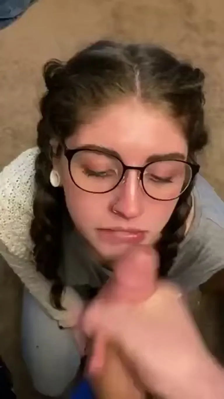 Decorating her glasses.