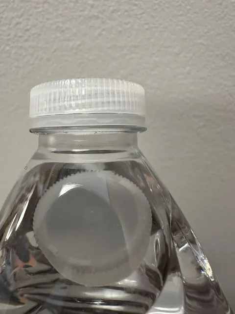 My unopened water has a cap in it.
