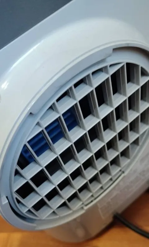 Lost my AC hose adapter in a roasting rental room. Fixed it with a takeout container and zip ties (zero damage/no tools).