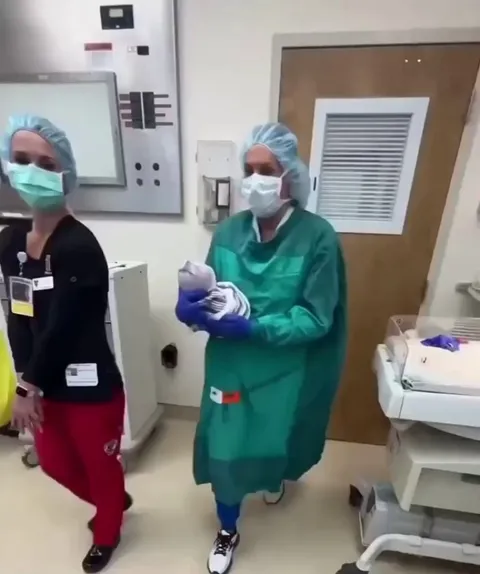 This nurse making the newborn kiss the momma and the baby immediately recognizes her and her voice