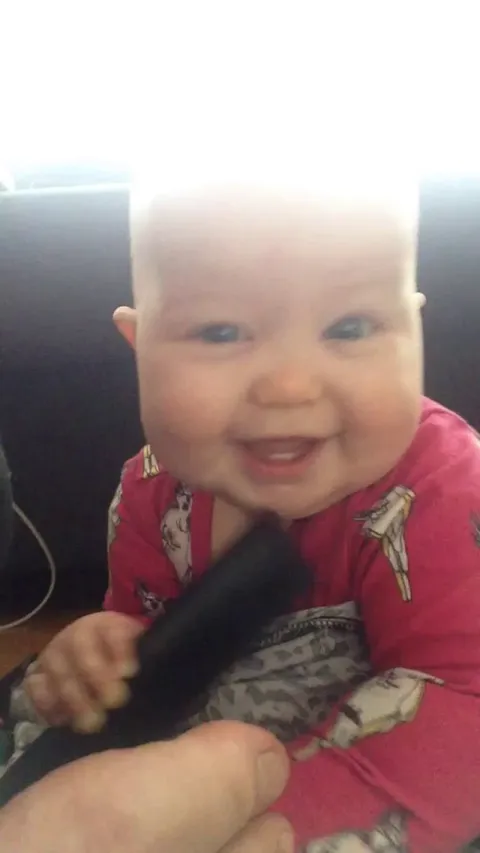 Baby hits herself with a TV remote