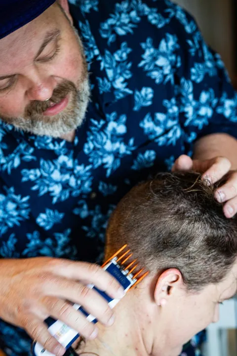 Shaving my head after week one of chemo