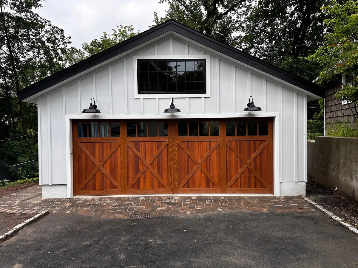 Before and after neighbor’s tree fell on our garage.