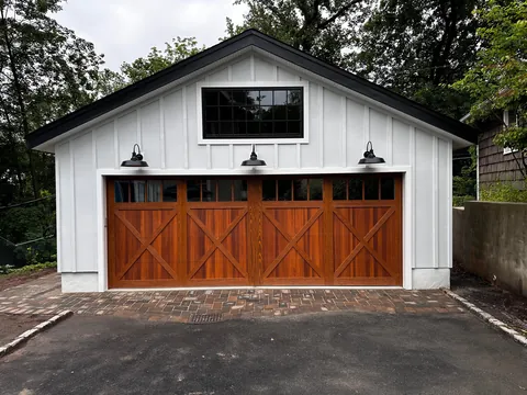 Before and after neighbor’s tree fell on our garage.