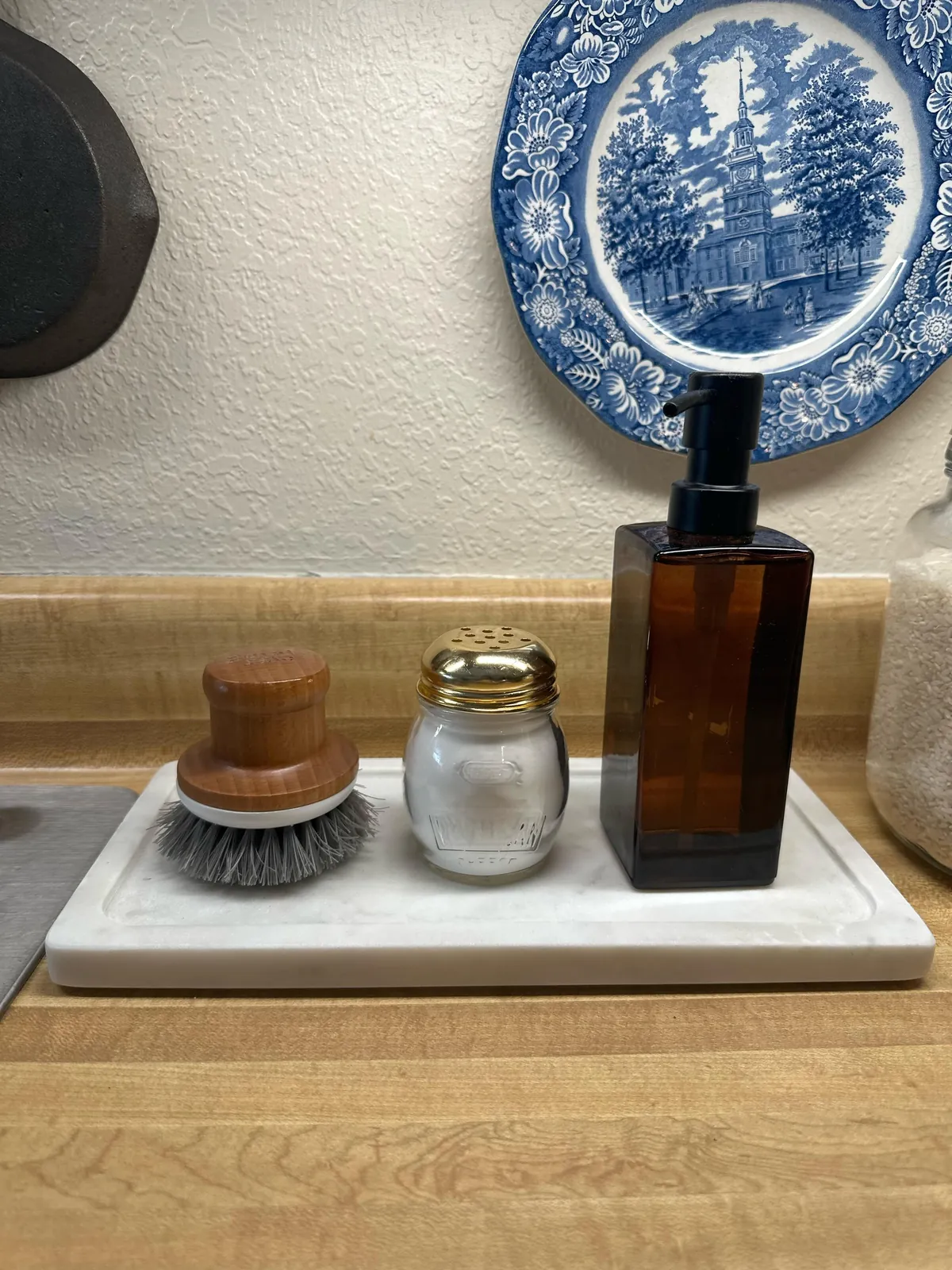 Thrift some vintage parm jars to use for baking soda for easy fridge deodorizing and by the sink to wash produce