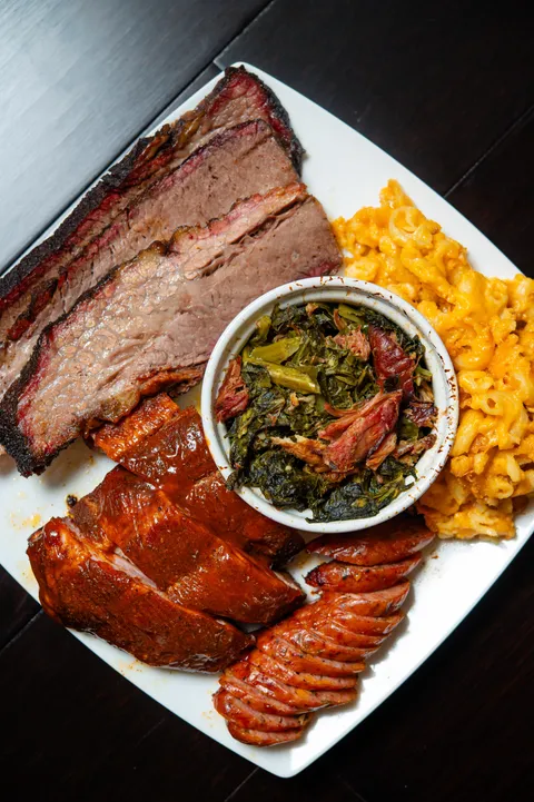 [homemade] smoked brisket, ribs, Mac and cheese, collard greens, and jalapeno cheddar sausage. 