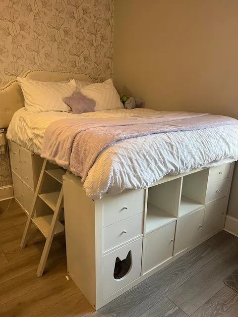 Built a storage bed with thrifted shelves