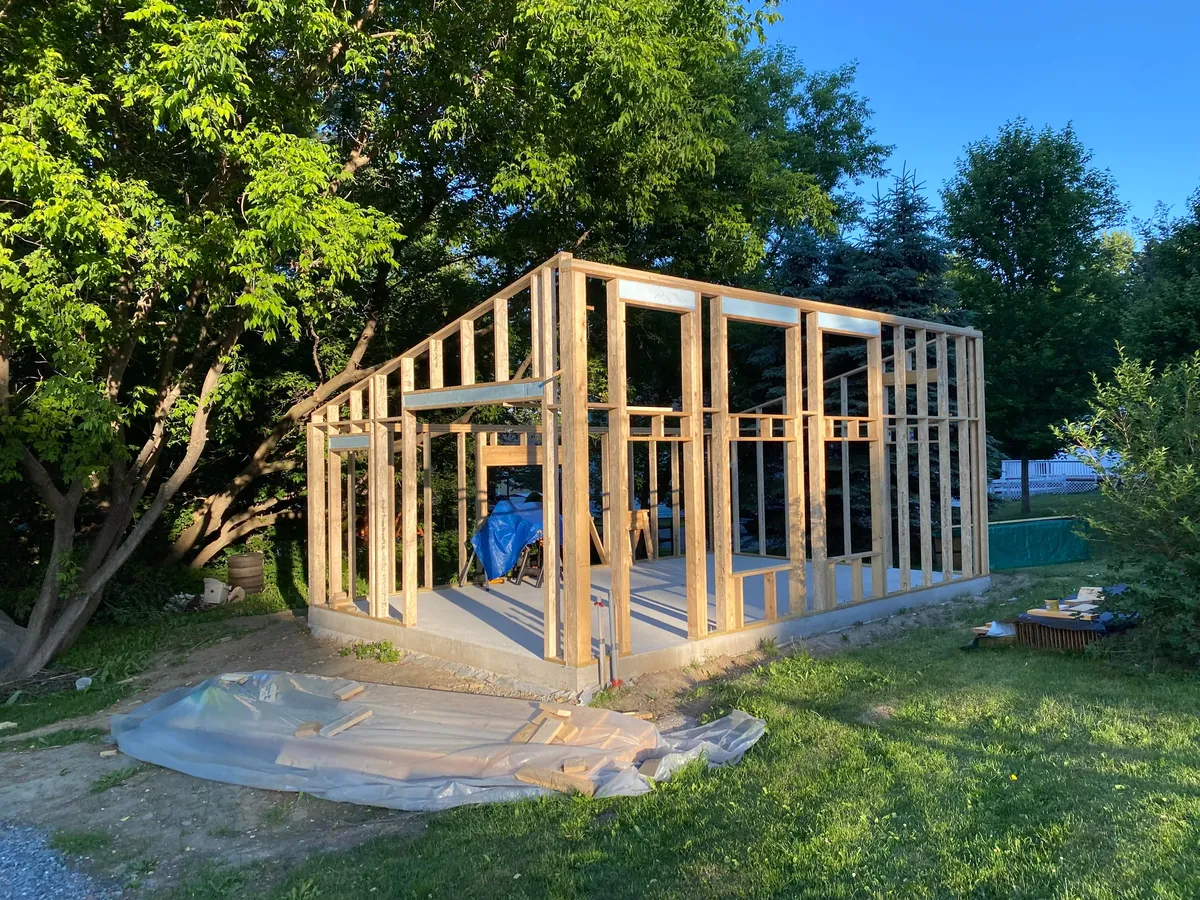 I built a 500 sq ft backyard shed studio for my photography business. I personally handled every phase from design to completion except for concrete, electrical, and HVAC. It's insulated and comfortable year round here in New Hampshire.  Ask me anything!