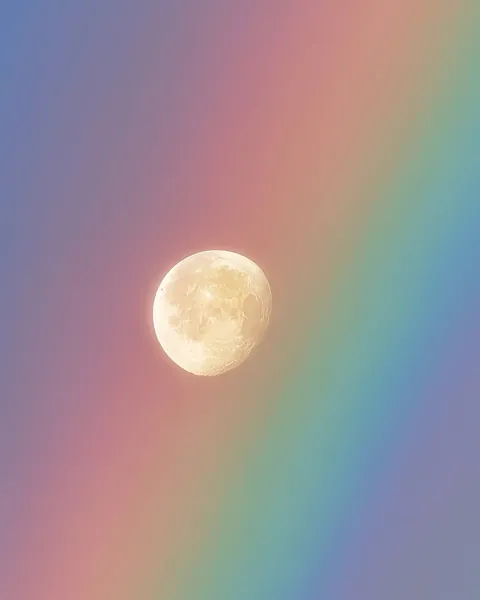 Moon and rainbow in harmony