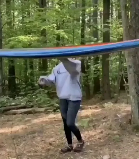 A technique for climbing into a hammock set up at a high elevation