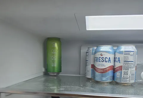 Can expanded in the refrigerator and is now wedged in so tight that it won't come out.