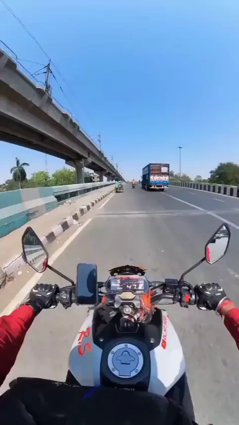 Bicker gives trike bike a push up hill on the freeway