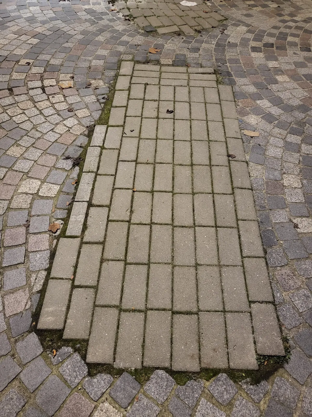 The way the utility company restored the pavement after breaking it open