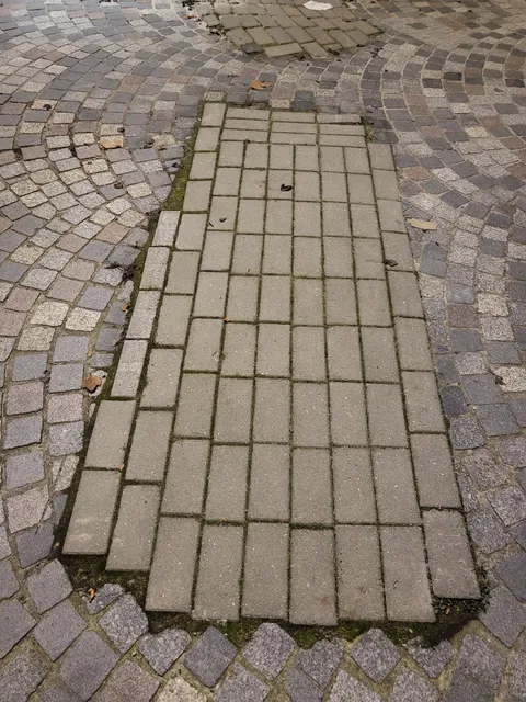 The way the utility company restored the pavement after breaking it open