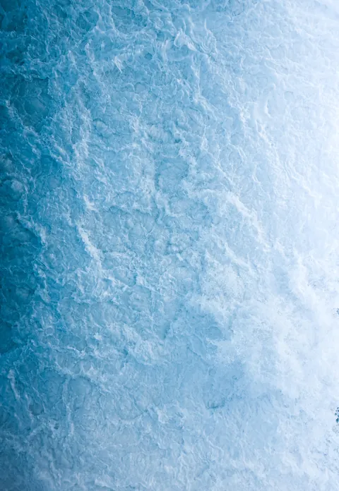 ITAP of texture on the water after a wave crashed into the rocks, Maine
