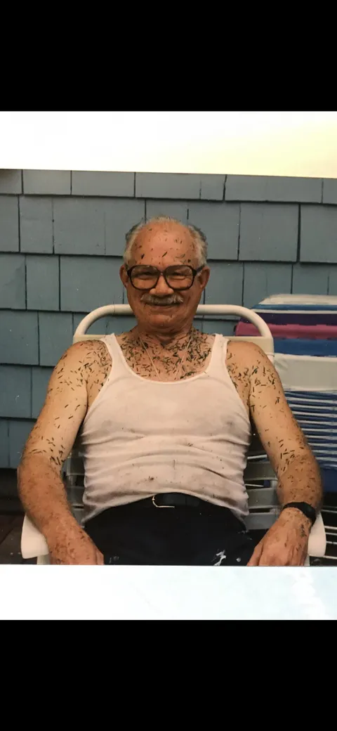 My Dad, “Buzz”, with a shit-eatin’ grin after showing the lawn who was boss, 1980s