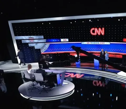 After the presidential debate, Joe Biden greeted by his wife Jill Biden while Trump walks off stage