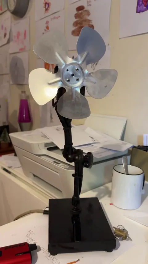 I added touch control to an old desk fan I made.