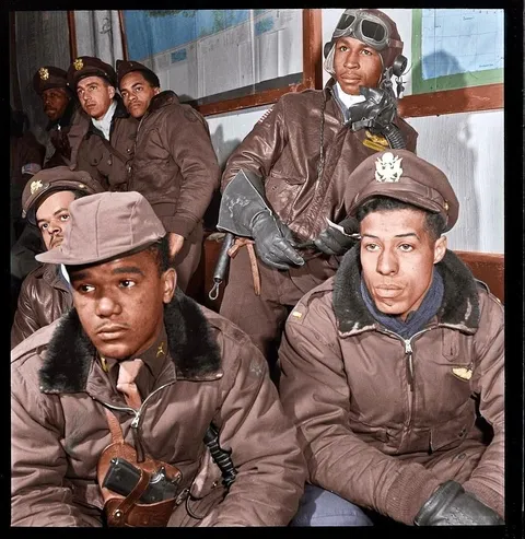 Tuskegee airmen getting briefed before a mission. 1945