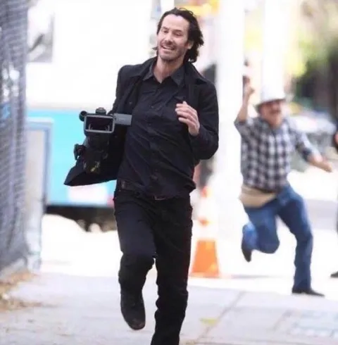 PsBattle: Keanu Reeves running from this paparazzi after stealing his camera