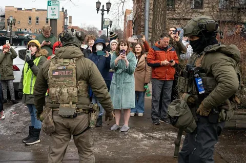 Ice being recorded by lady in bathrobe