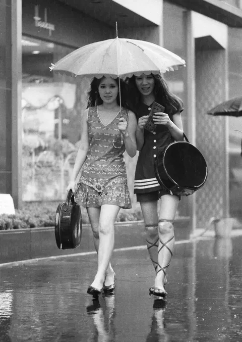 Caught in the rain in the Ginza district, Tokyo, Japan, 1969