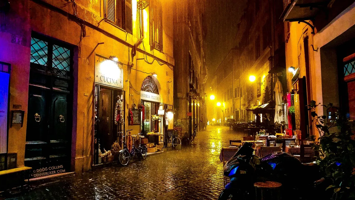 I, too, was caught in a sudden Roman rainstorm. What had been a busting street filled with tourists and diners became suddenly quiet and serene after everyone had rushed for cover. It's one of my favorite memories of visiting.