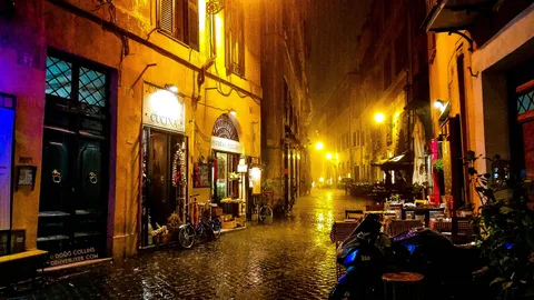 I, too, was caught in a sudden Roman rainstorm. What had been a busting street filled with tourists and diners became suddenly quiet and serene after everyone had rushed for cover. It's one of my favorite memories of visiting.