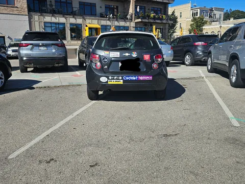 I couldn't park because a tiny car that could fit into 1/2 of a spot took up 2 full spots.