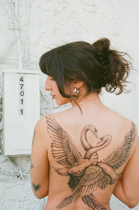 Entangled swans back piece by @chriscalibur_ at Ocho Placas in Miami