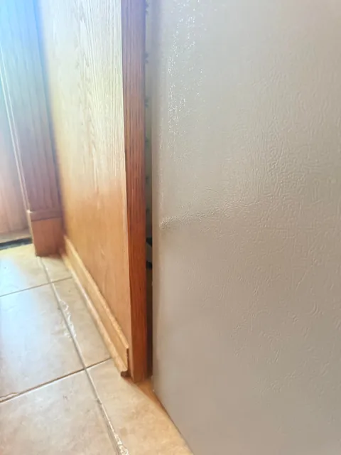 How would you guys go about getting this fridge to fit, it is VERY close.