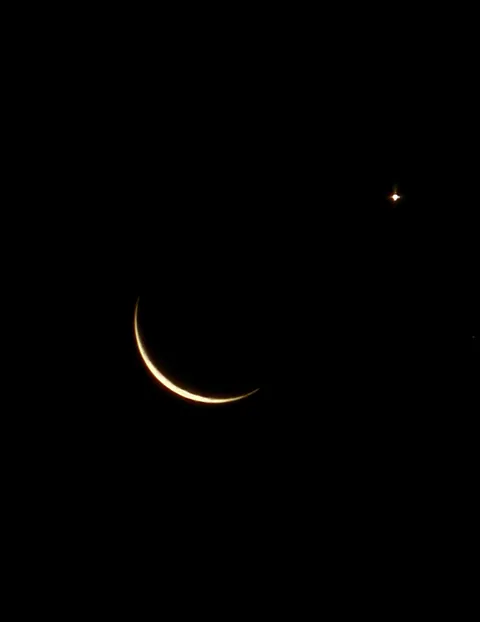 Picture I took this morning of the moon and Venus.