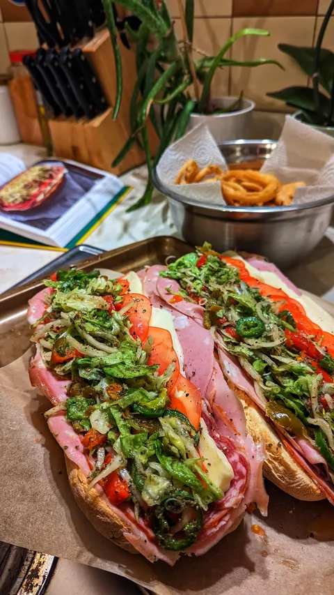 Matty Matheson's "The Bodega" submarine sandwich with a side of onion rings