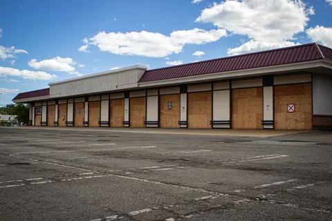 Sears Auto Center sitting idle in a slowly dying malls parking lot.